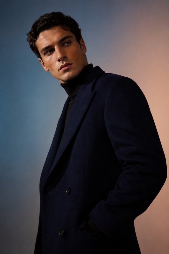 Navy coat studio portrait for face detail enhancement